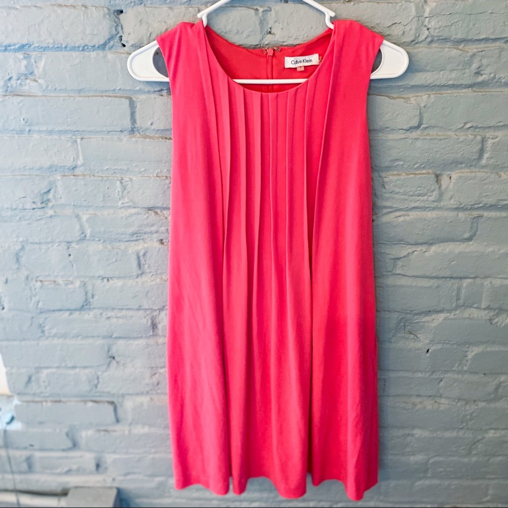 Fun, coral pleated dress